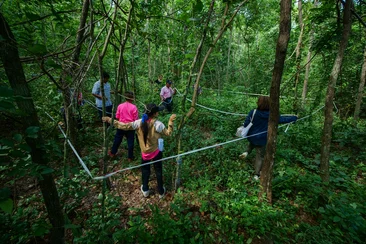 RECOFTC and ZSL staff conducting a plot sampling training for Ban Sa Si Mum community forest members. This practice enables them to systemically identify and monitor biological resources in their forest.