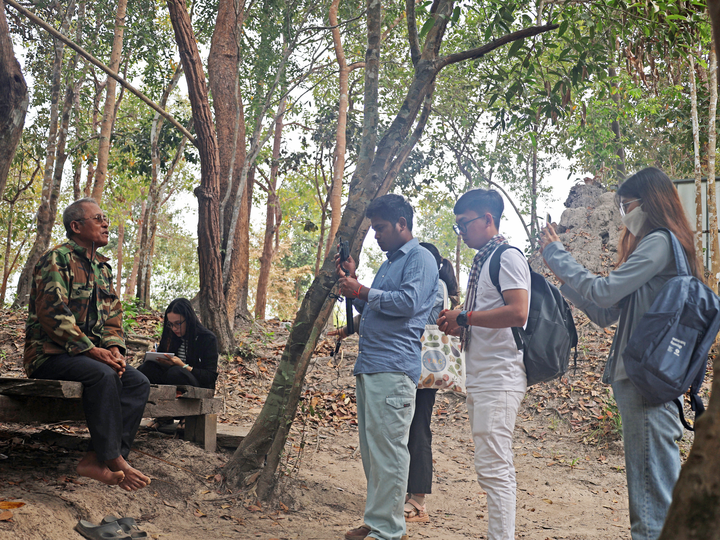 Cambodian youth conduct a video interview in O Pong Roung Community Forest.
