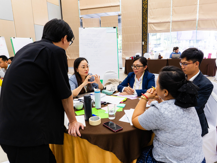 Explore researchers participating in a participatory action research training workshop