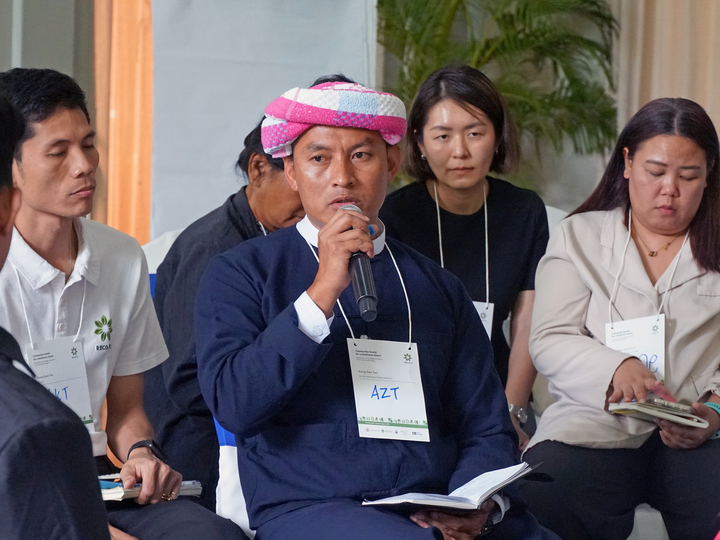 Indigenous Peoples speaking during a conference session on community forests and biodiversity.