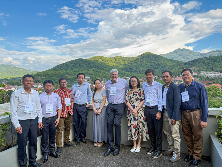 A group photo of Explore-supported researchers standing alongside members of the RECOFTC team.