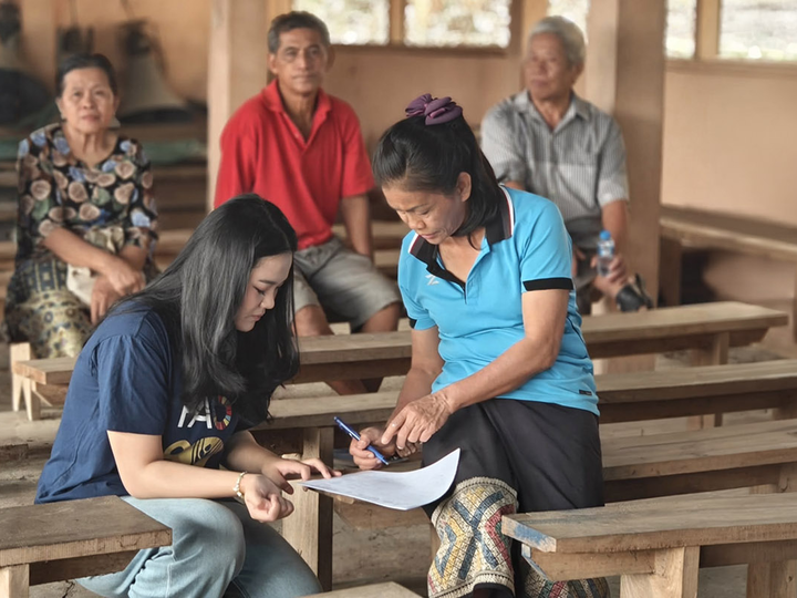 Lao youth guardians conducting interviews on forest fire