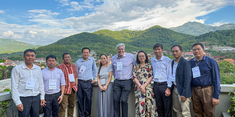 A group photo of Explore-supported researchers standing alongside members of the RECOFTC team.