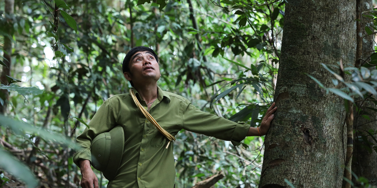Luong Van Nguyen, a village chief, patrols a section of the community forest his village manages in Thong Thu commune, Que Phong district, Viet Nam. Photo by RECOFTC.