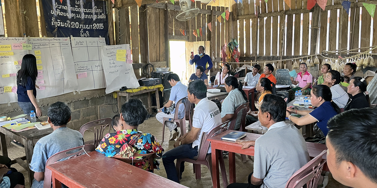Noukone Duangoudom, project assistant, RECOFTC Lao PDR facilitates a session on identifying the top-five forest products collected from village forests at the village forest community center in Houaythong village, Lao PDR. Photo: RECOFTC.