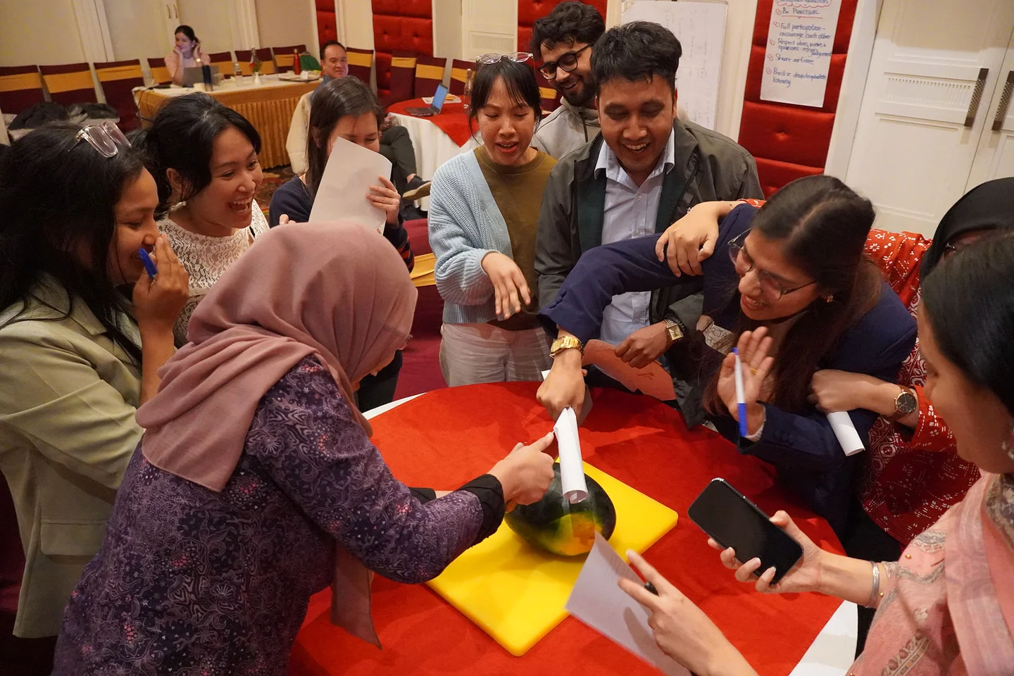 Participants in the Waves program engage in a group activity to practice negotiation skills for ethical decision-making related to gender, climate change and forestry