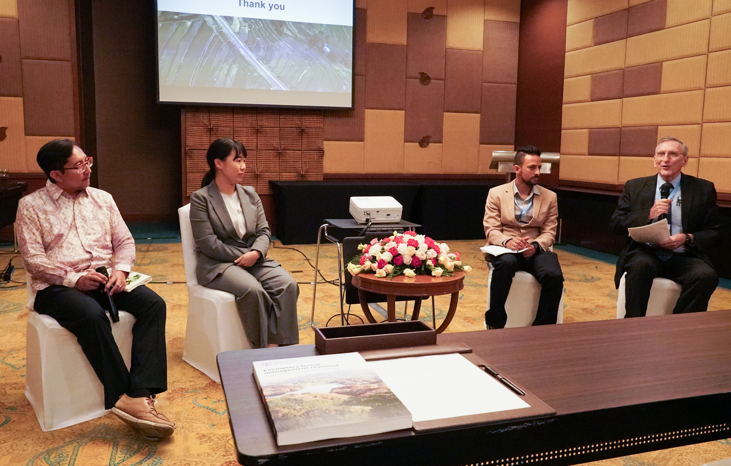 Patrick Durst (right), president at ISTF, moderates a panel discussion