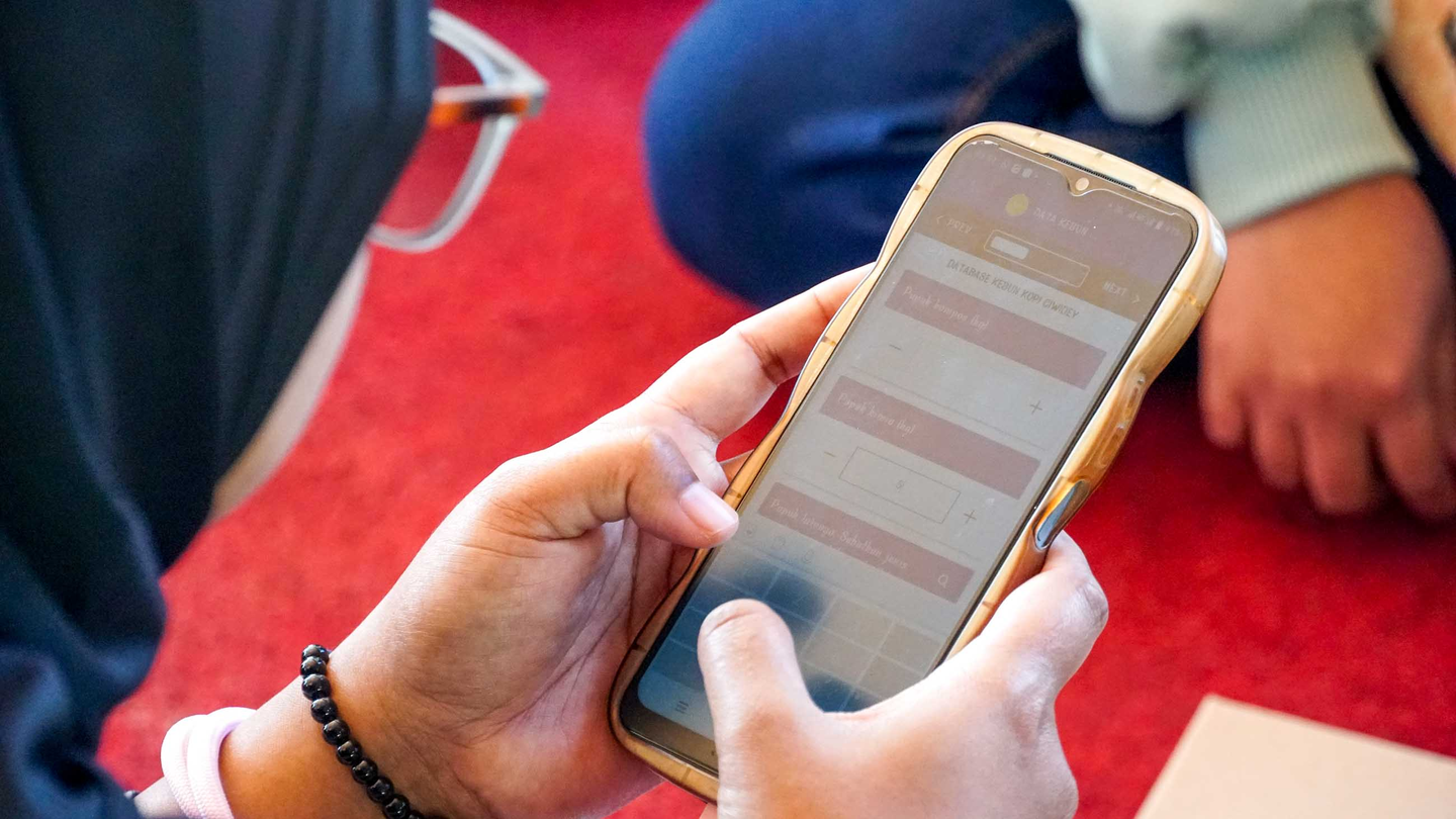 Young women working on monitoring via cell phone