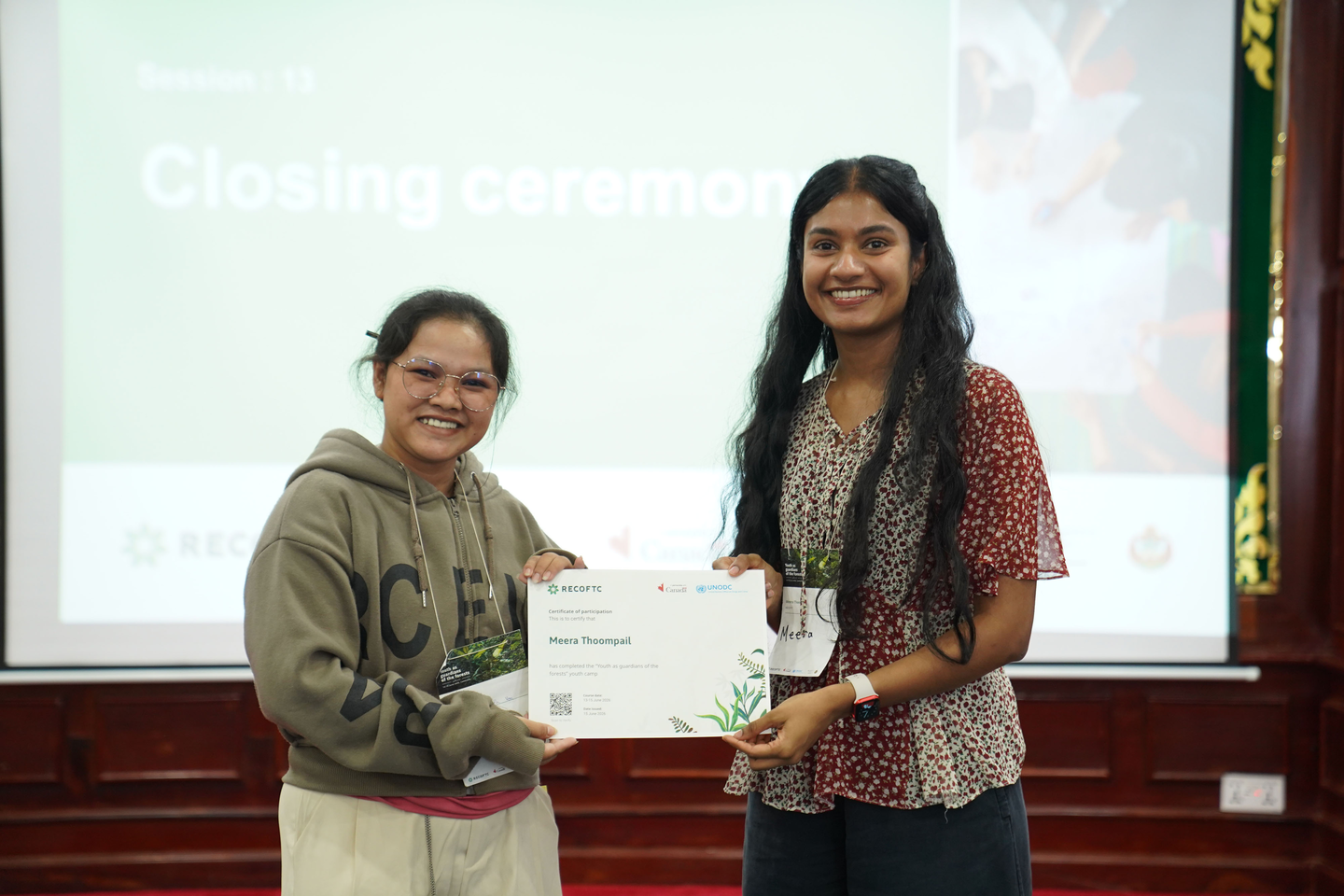 Youth present camp certificates to their fellow participants in a relay format.