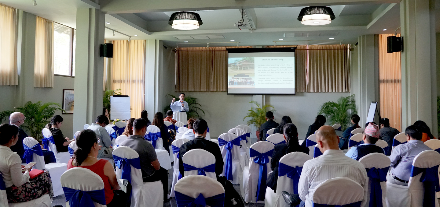 A photograph of Sypha Chanthavong, a lecturer and co-principal investigator with the National University of Laos, speaking and sharing Explore research findings regarding the Eudou and Ngouang ethnic groups.