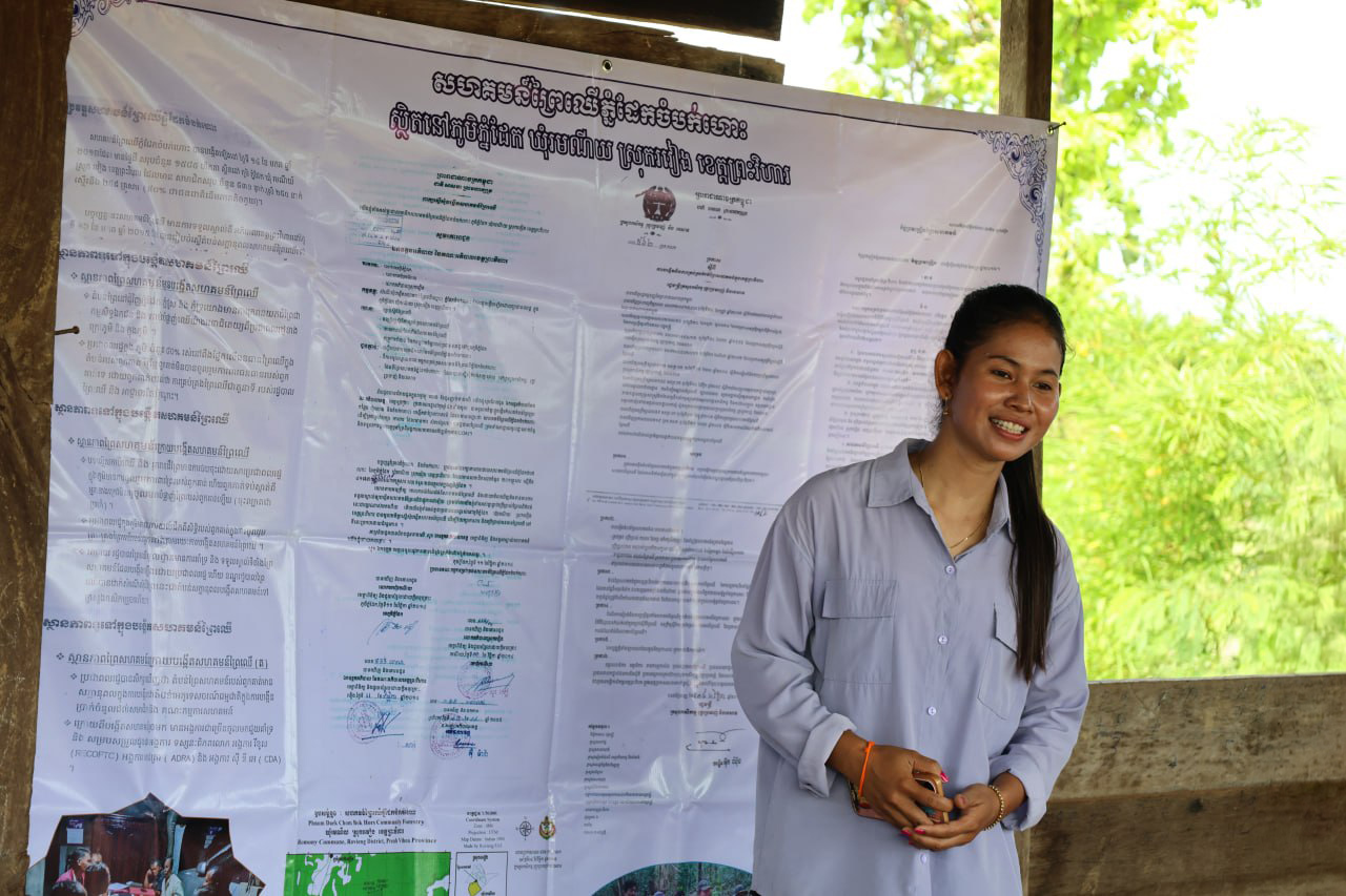 Cambodian youth guardian raising awareness at a community event