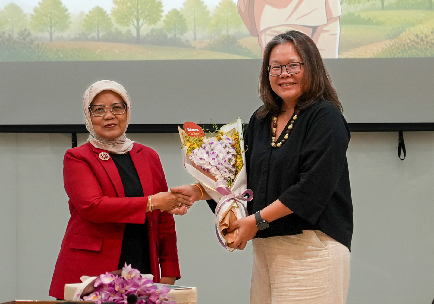 Nur Masripatin and Ivy Wong at the board handover event