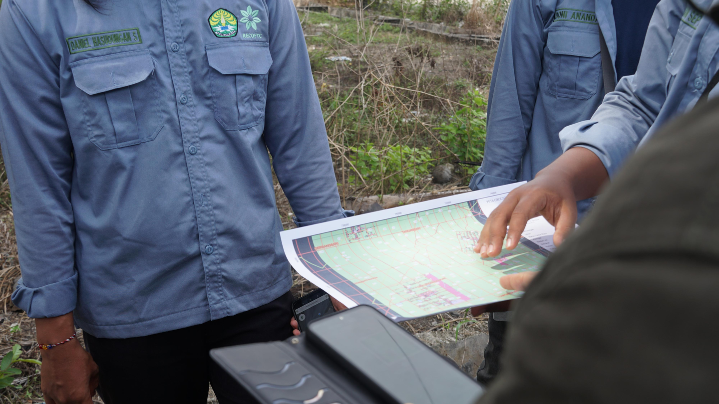 Students examining a land cover map in Indonesia