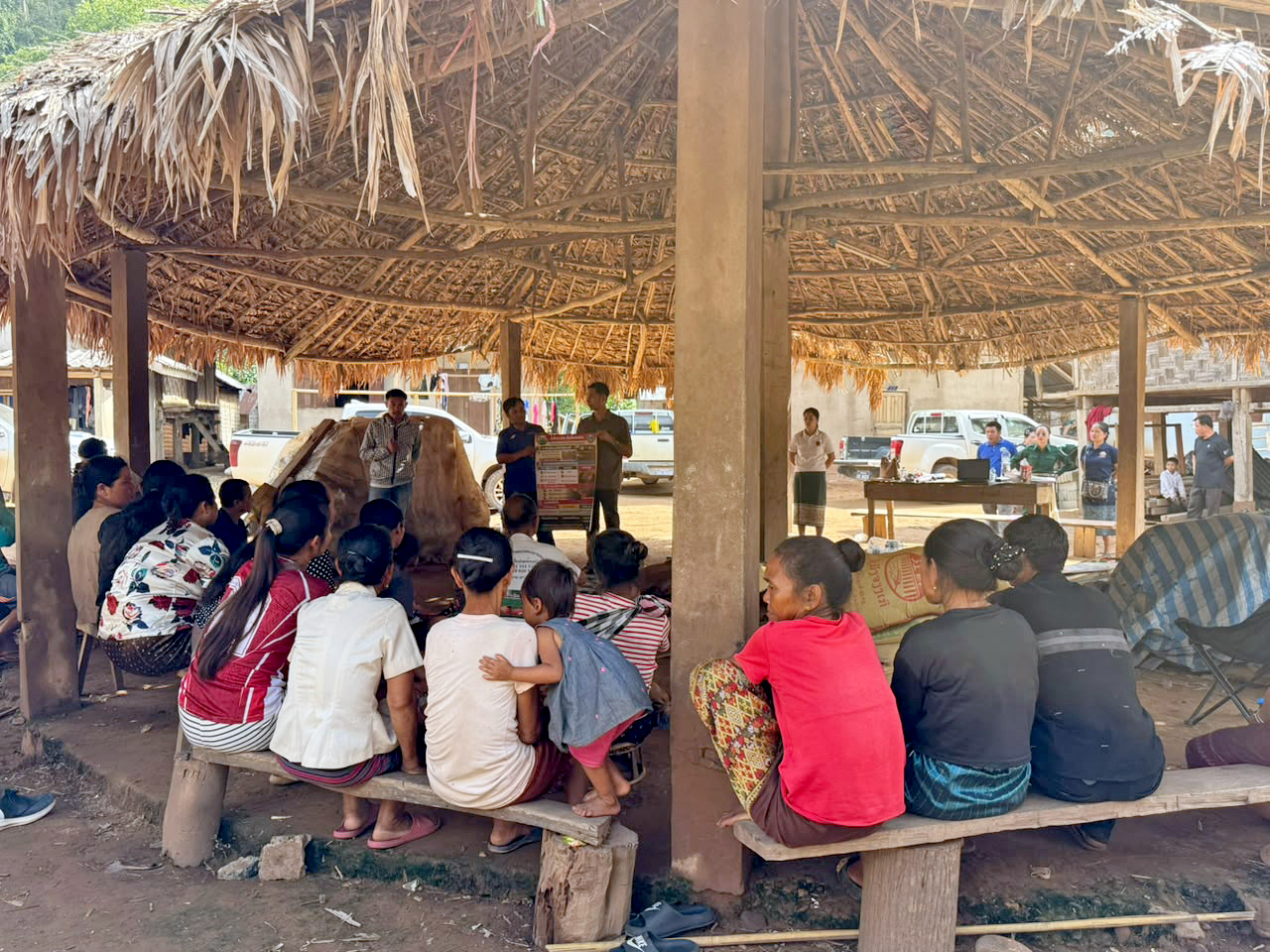 Women and men from Tadmouan village sit together during a discussion on sustainable forest management.